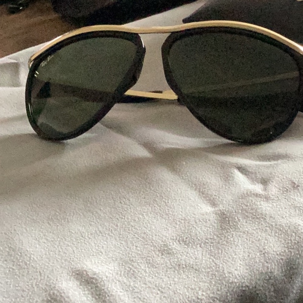 Ray-Ban sunglasses.